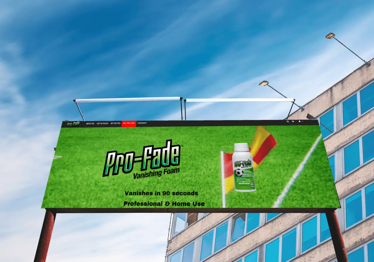 The Pro-Fade site on a roadside billboard against a blue sky: the product bottle beside a corner flag on a pitch